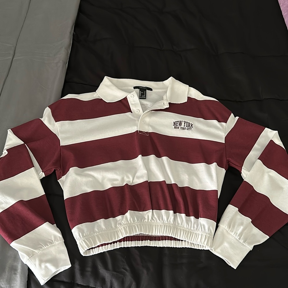 Small cropped shirt. No stains, never worn, no rips, ALL clean